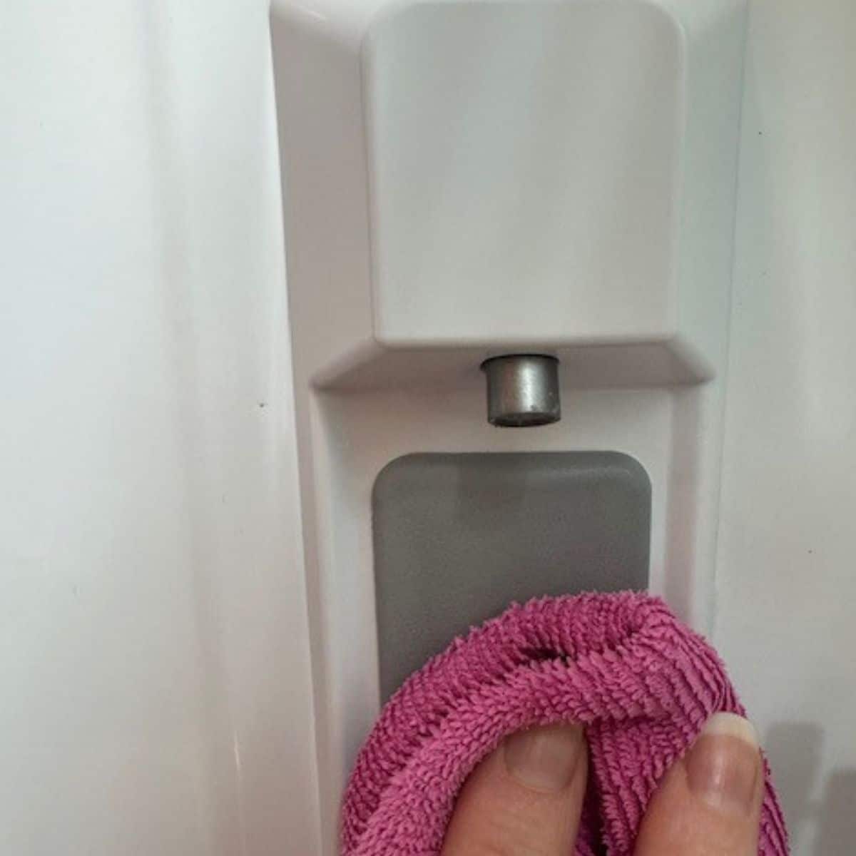 clean refrigerator water dispenser nozzle